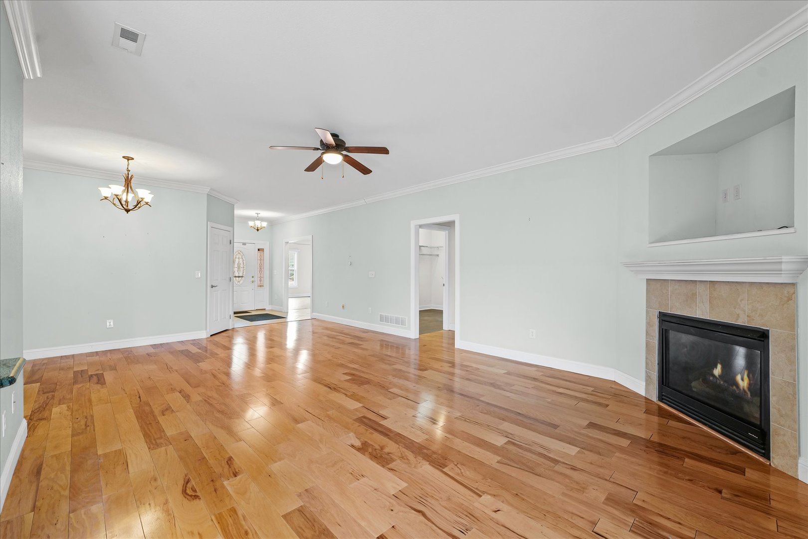 1908 S Prairie Urbana, IL 61802 - Photo 9 of 32 a view of empty room with wooden floor and fireplace