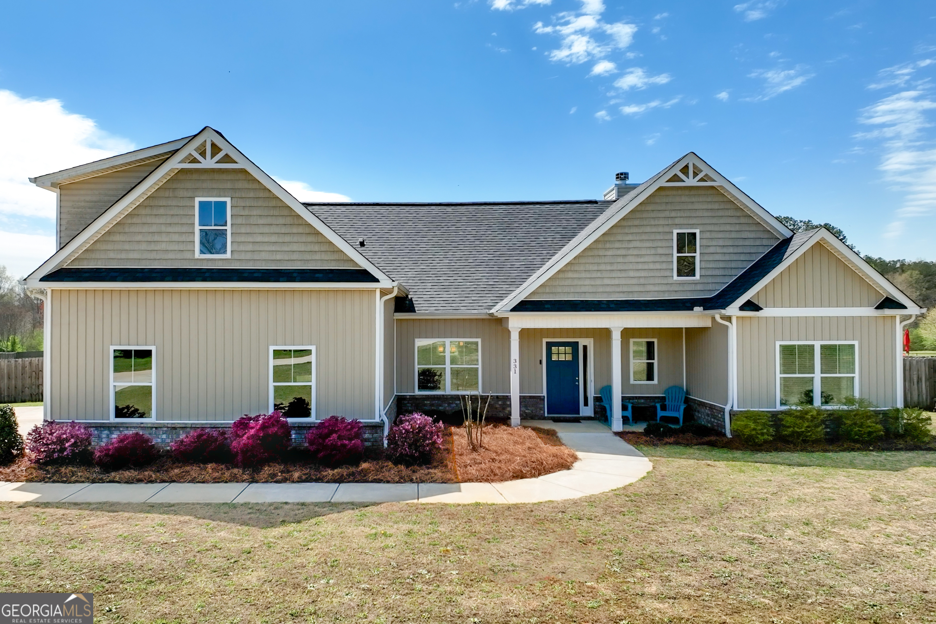 331 High Falls Road Jackson, GA 30233 - Photo 1 of 1 a front view of a house with a yard and garage