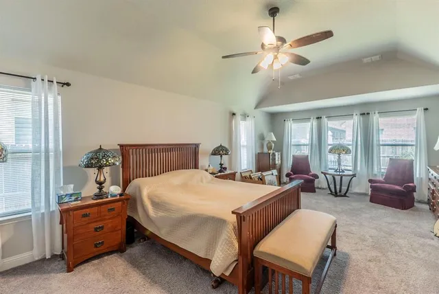 a bed room with a bed and a chandelier