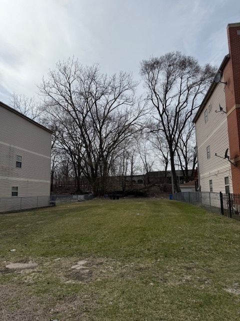 a view of a tree in front of a house