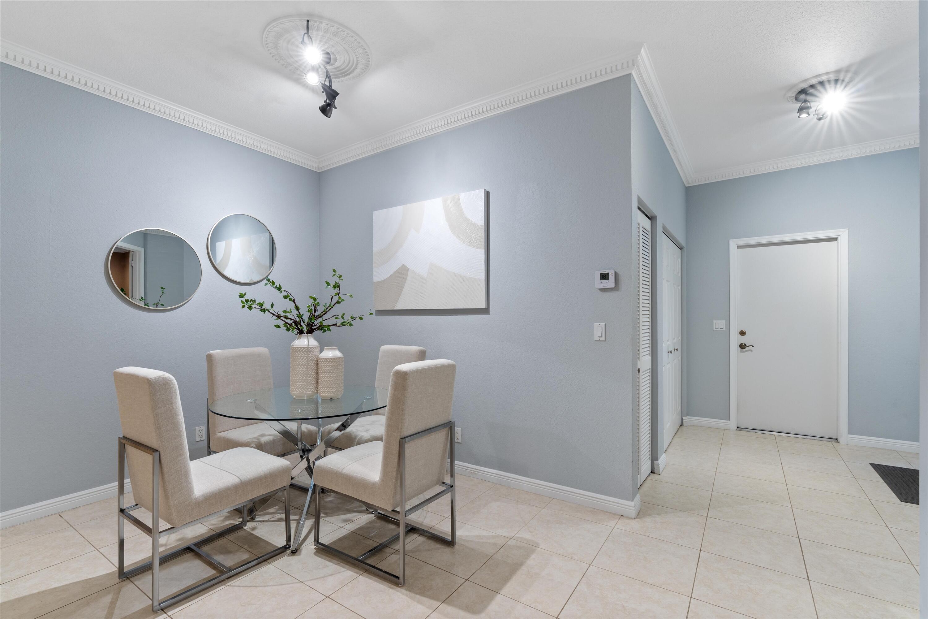 16055 Sims Road, Unit 103 Delray Beach, FL 33484 - Photo 12 of 60 Modern dining area with stylish flair.