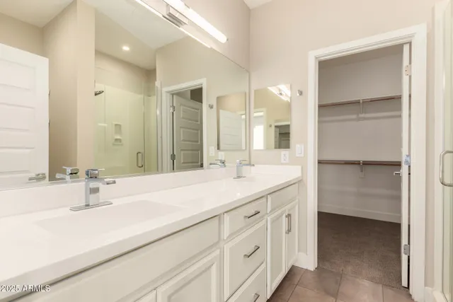a bathroom with a double vanity sink mirror and double