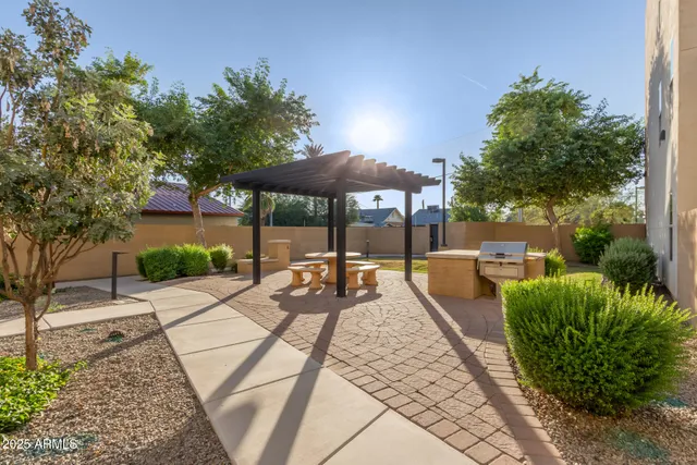 a view of a backyard with sitting area