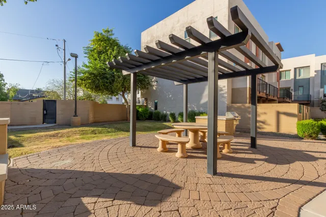 a view of a backyard with a patio