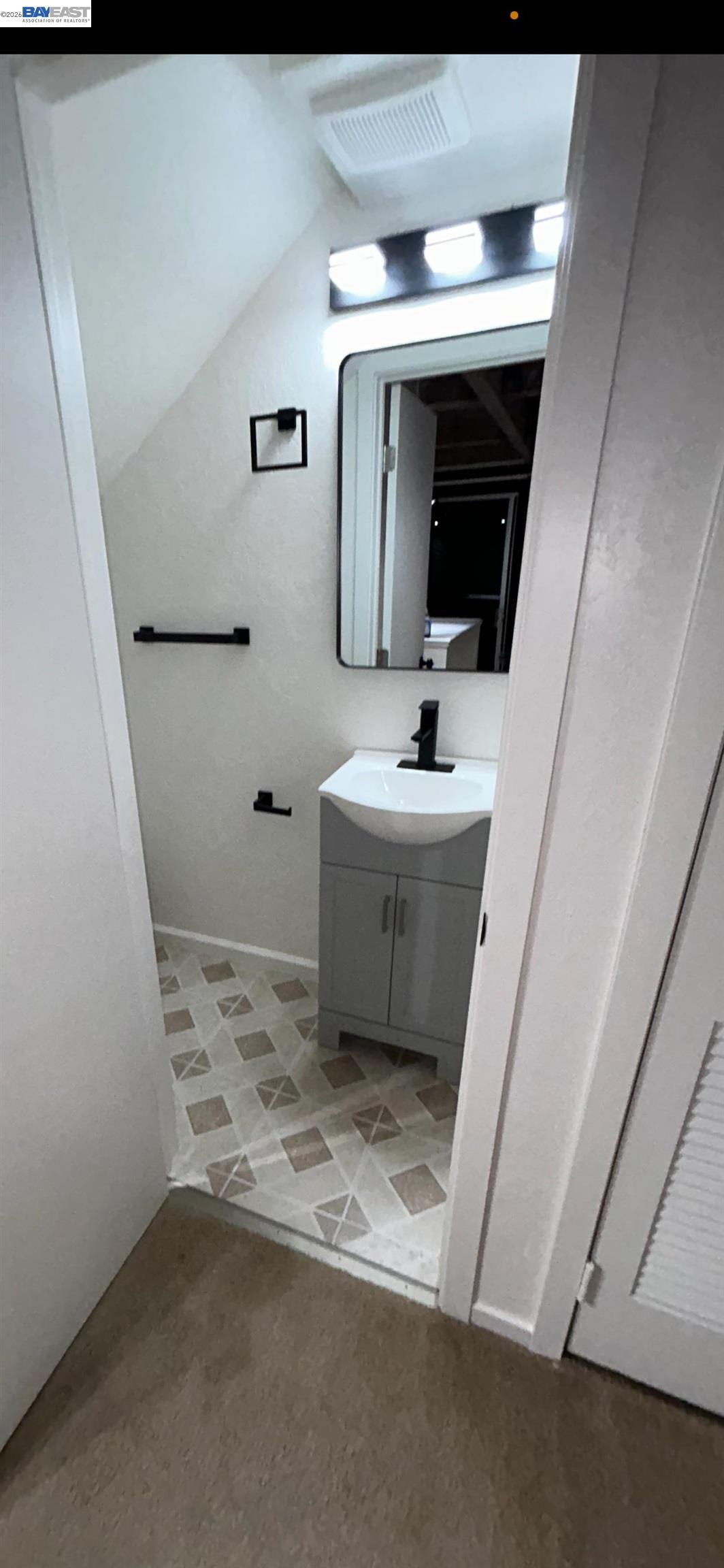 902 F Street Davis, CA 95616 - Photo 15 of 28 a bathroom with a sink and a mirror