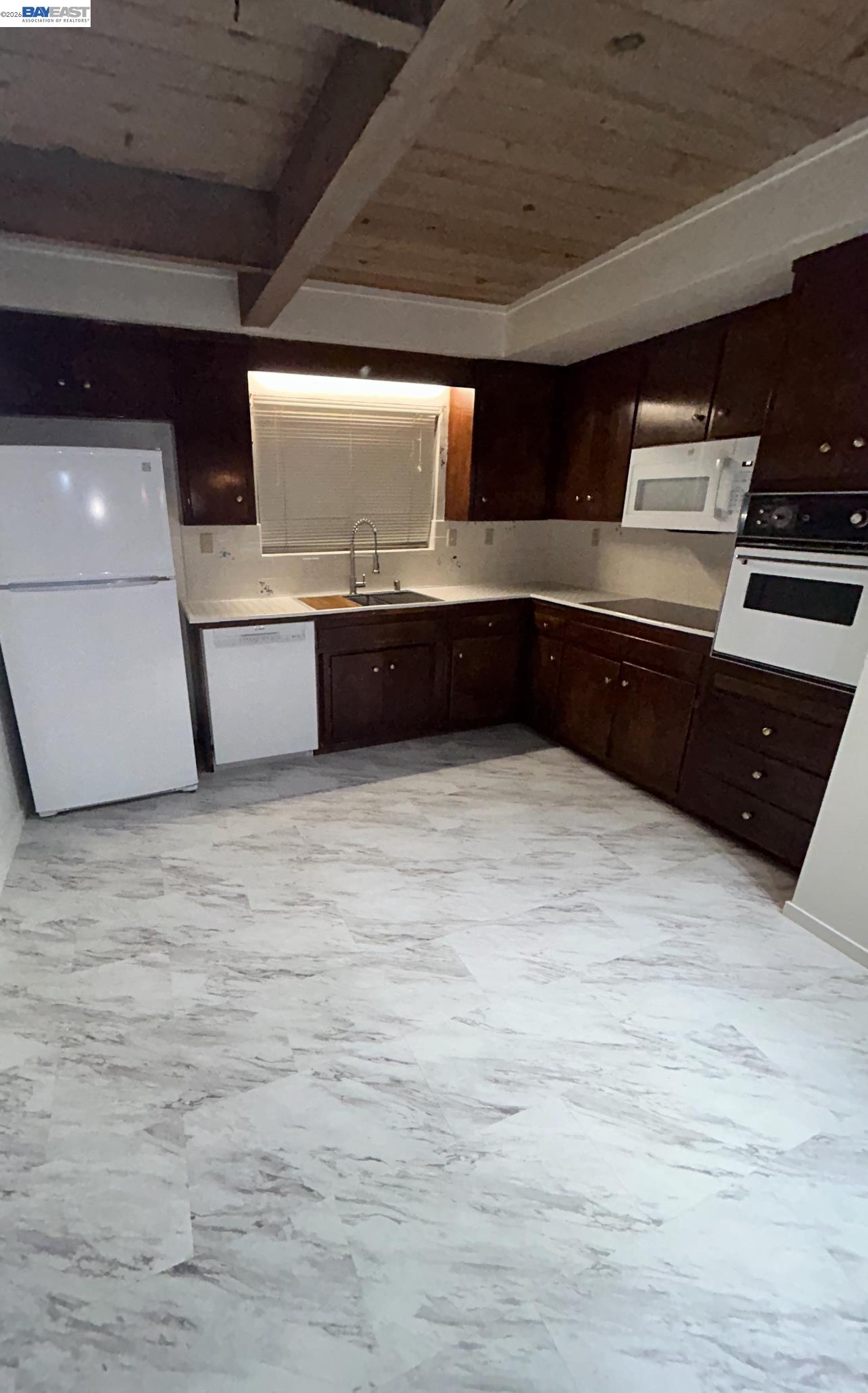 902 F Street Davis, CA 95616 - Photo 4 of 28 a kitchen with stainless steel appliances wooden cabinets and a counter top