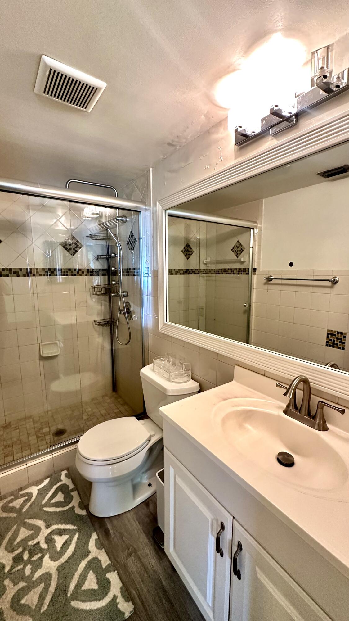 533 Shady Pine Way, Unit B1 Greenacres, FL 33415 - Photo 12 of 19 a bathroom with a sink and a mirror