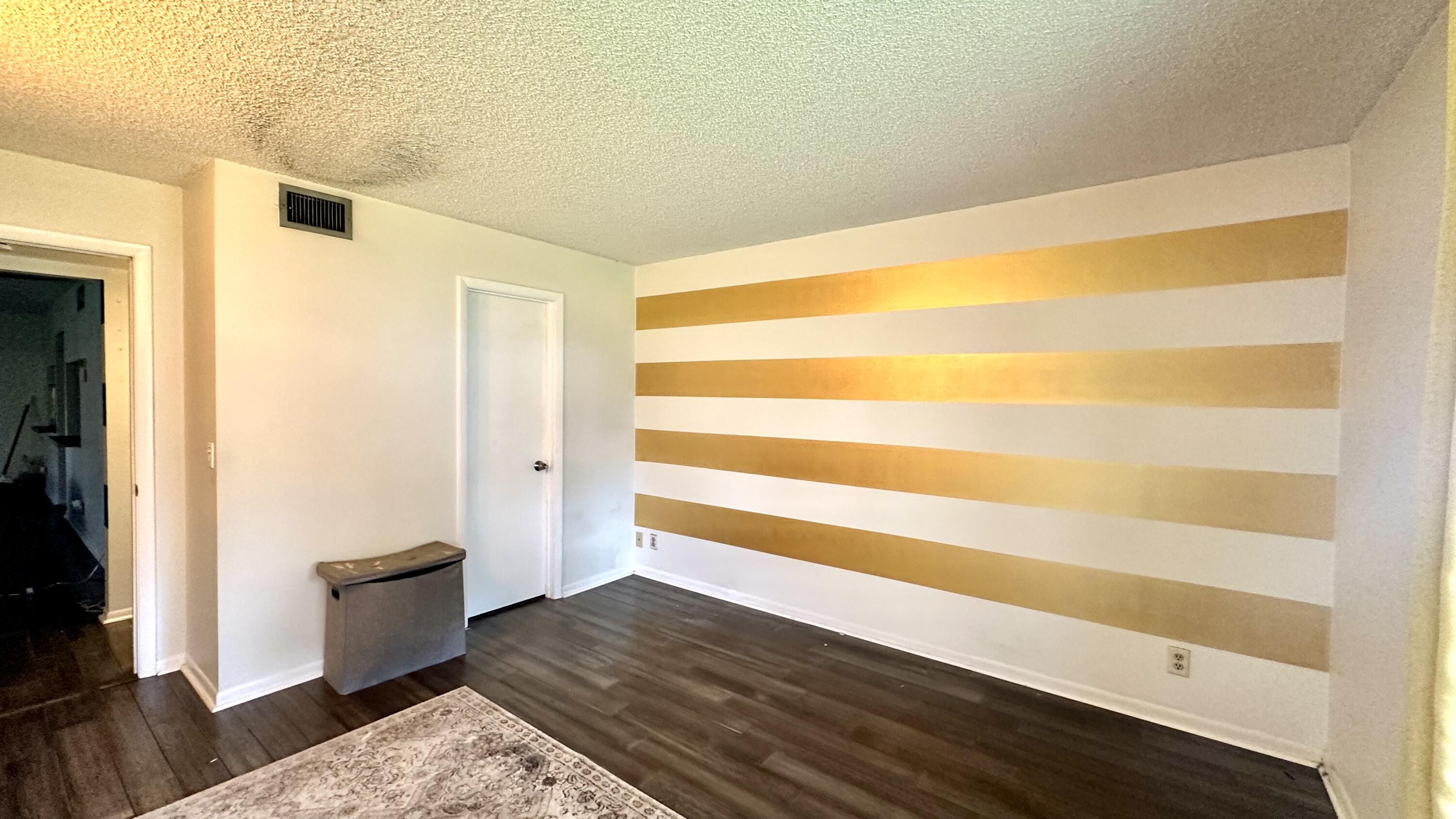 533 Shady Pine Way, Unit B1 Greenacres, FL 33415 - Photo 14 of 19 a view of an empty room and wooden floor