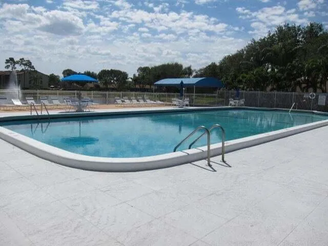 a view of a swimming pool with a terrace
