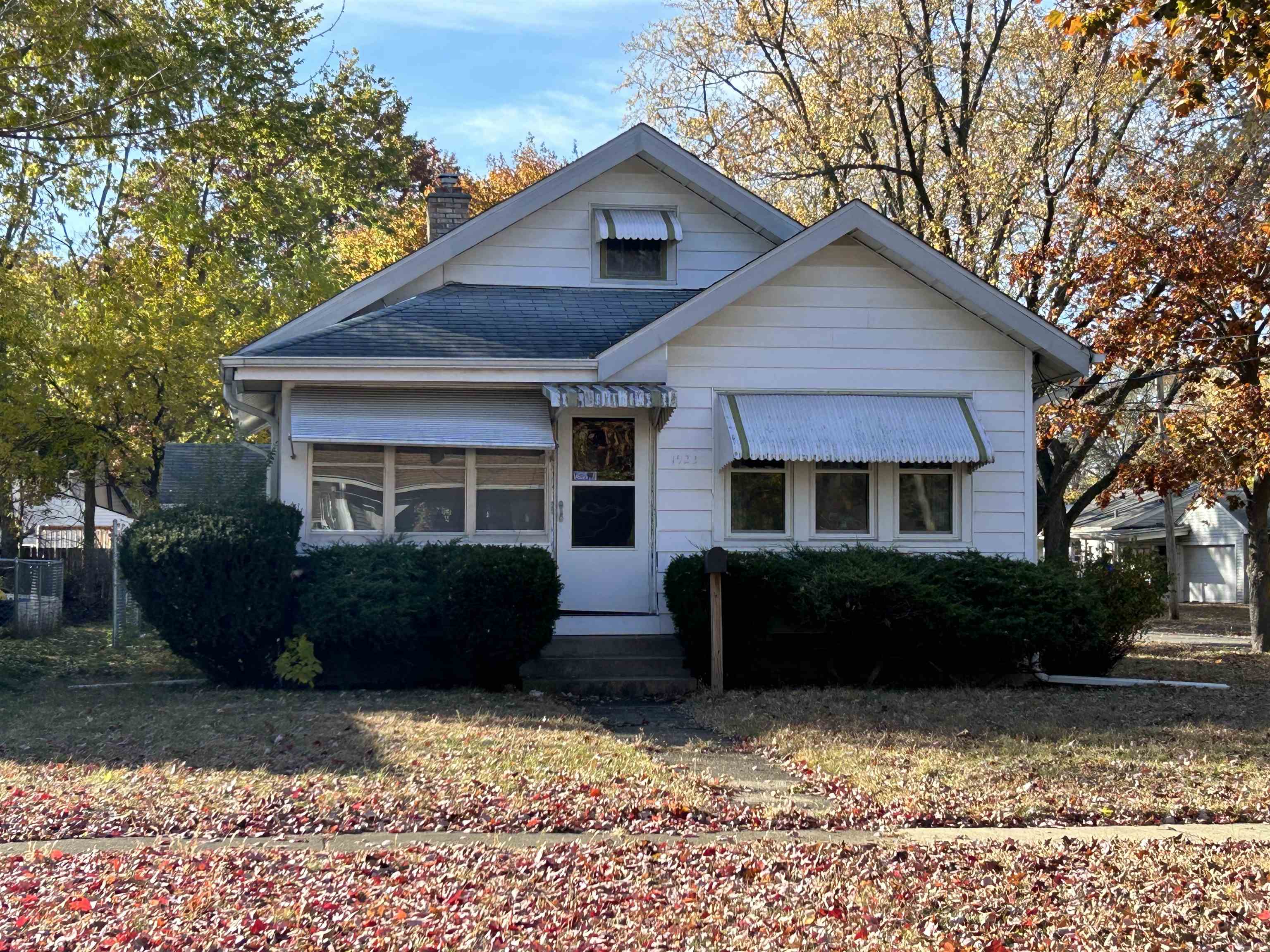 1922 Bruner Street Rockford, IL 61103 - Photo 1 of 18 a front view of a house with a yard