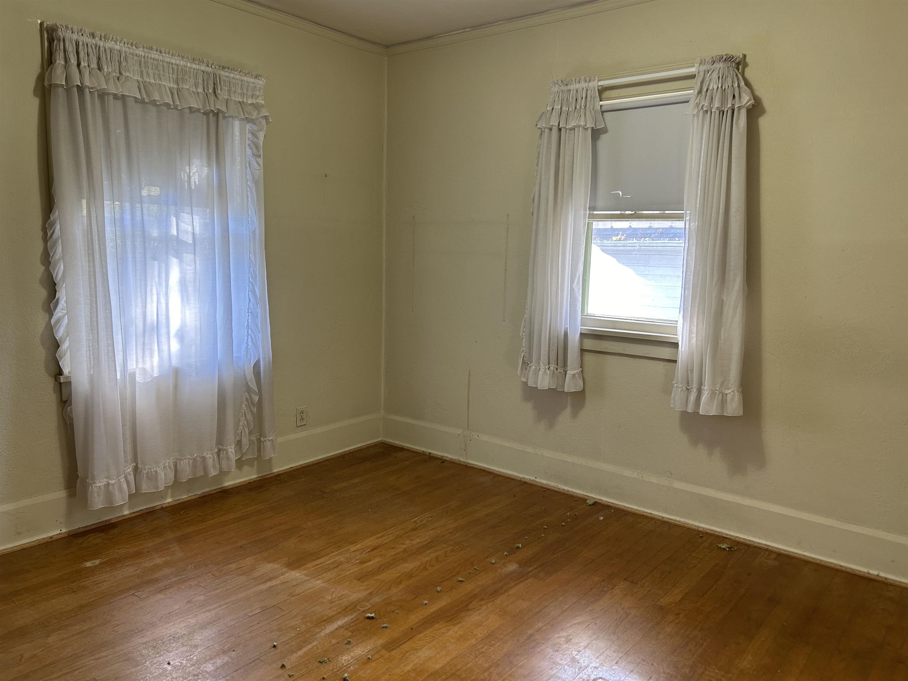 1922 Bruner Street Rockford, IL 61103 - Photo 11 of 18 an empty room with wooden floor and windows