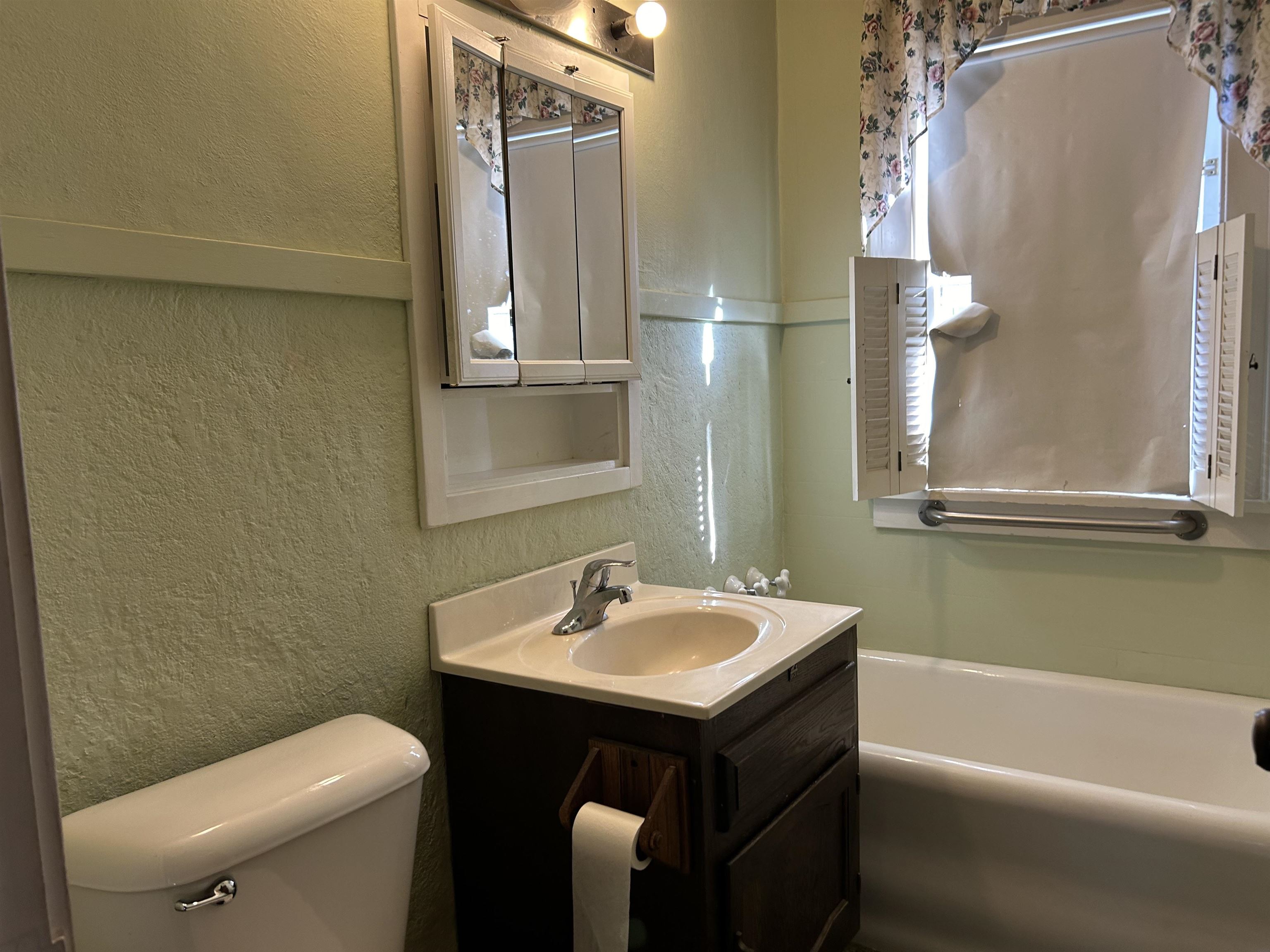 1922 Bruner Street Rockford, IL 61103 - Photo 14 of 18 a bathroom with a sink and a mirror