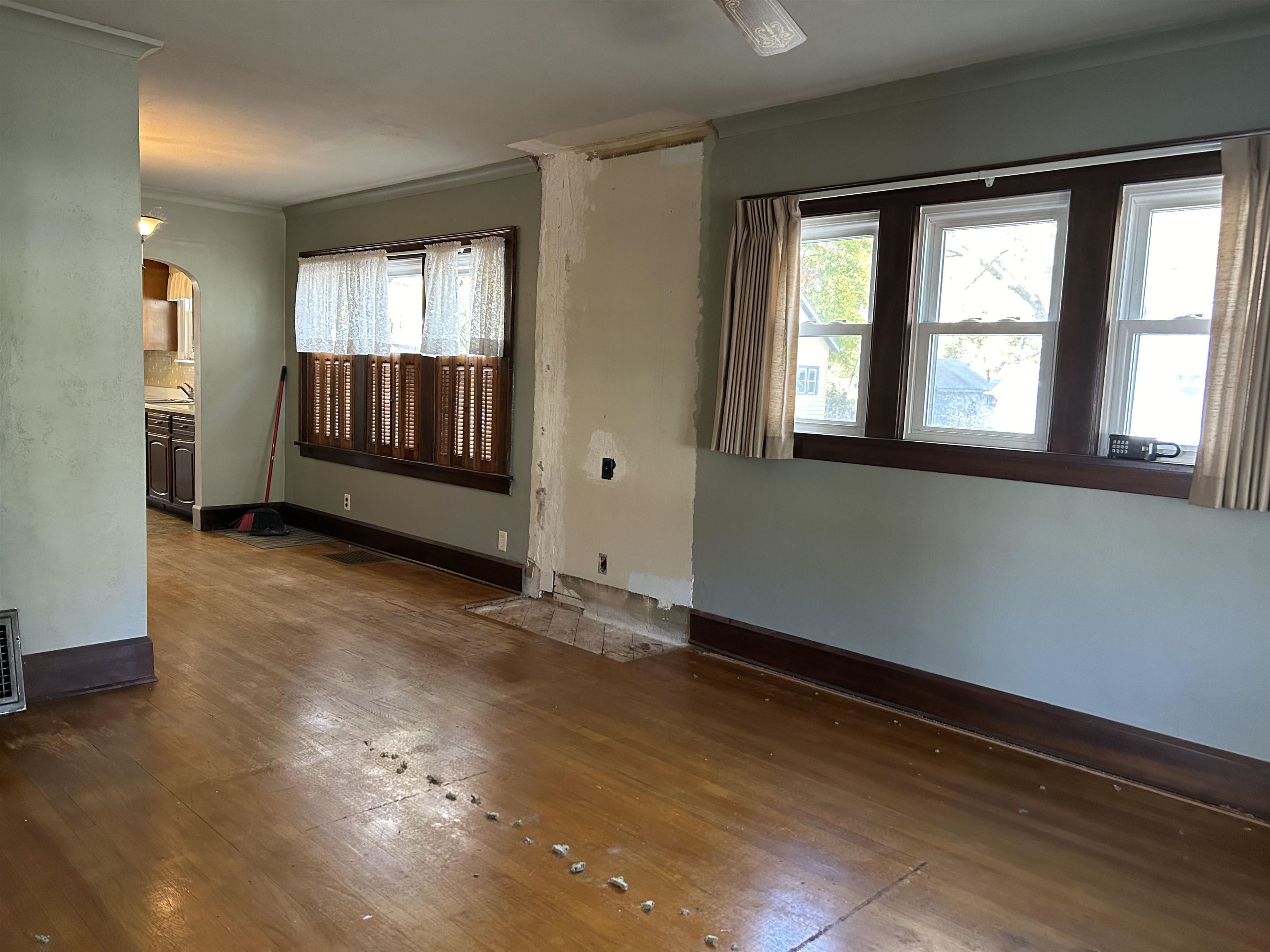 1922 Bruner Street Rockford, IL 61103 - Photo 4 of 18 an empty room with wooden floor and windows