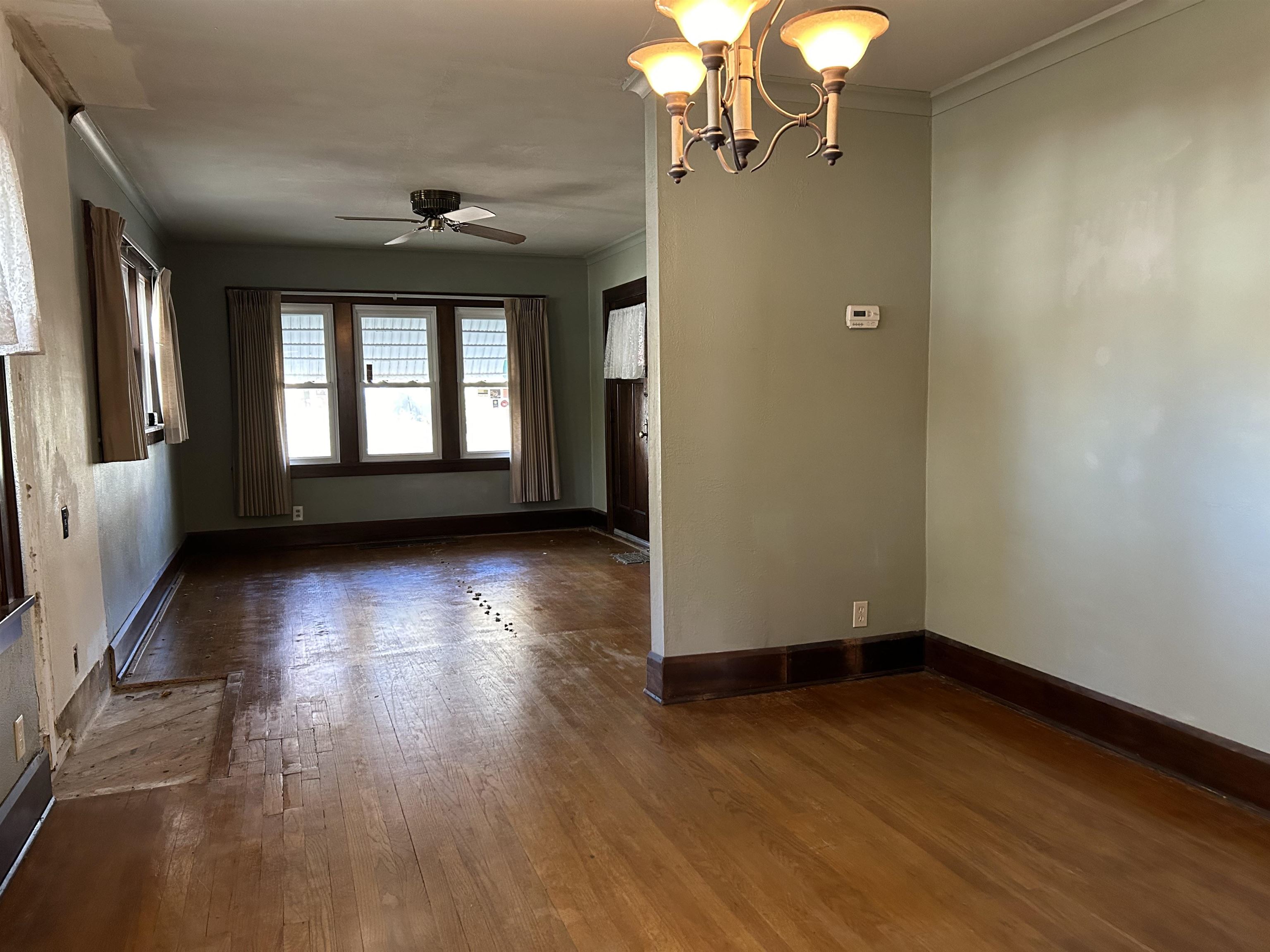 1922 Bruner Street Rockford, IL 61103 - Photo 5 of 18 an empty room with wooden floor and windows