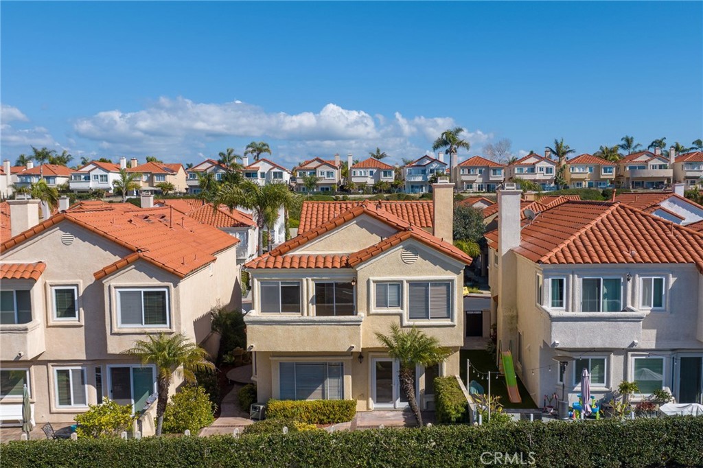 a front view of a residential apartment building with a yard
