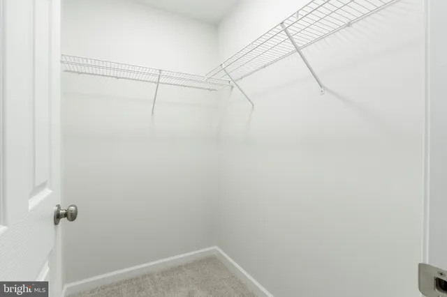 a bathroom with a granite countertop sink toilet and a mirror