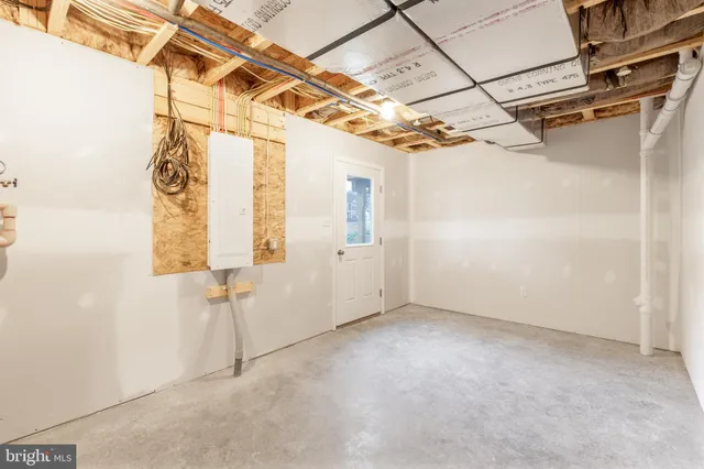 a view of a room with white walls