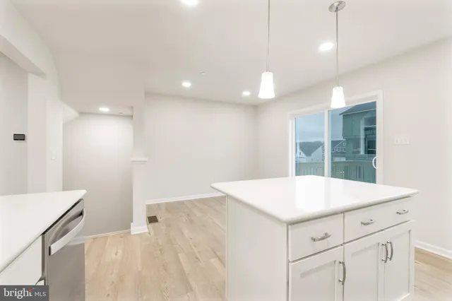 a kitchen with a sink and a refrigerator