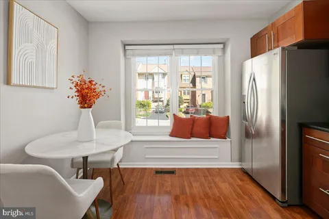 a kitchen with stainless steel appliances a stove a sink and a refrigerator