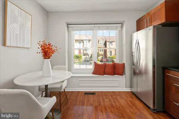 a kitchen with stainless steel appliances a stove a sink and a refrigerator