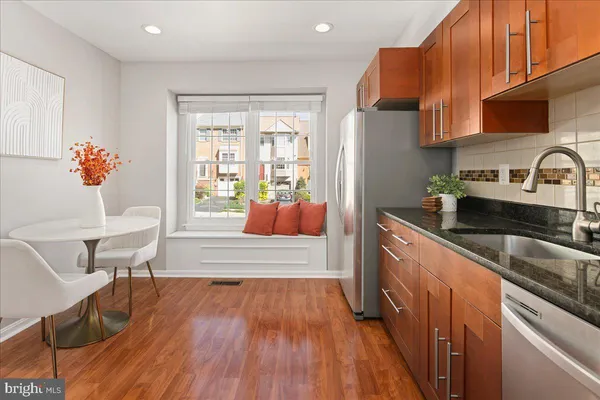 a living room with furniture and floor to ceiling windows
