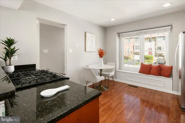 a living room with furniture and large windows