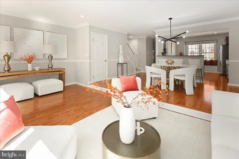 a bedroom with a bed a table and windows