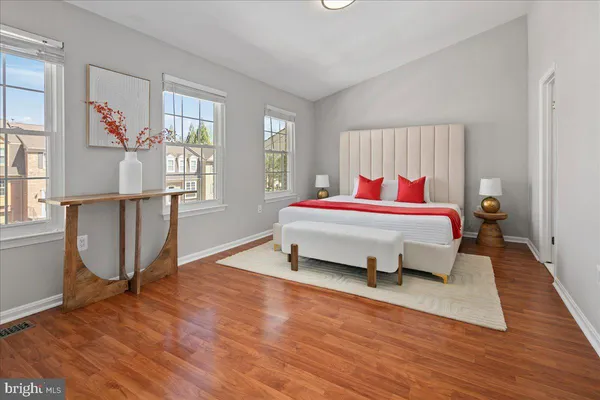 a bedroom with a bed and a window
