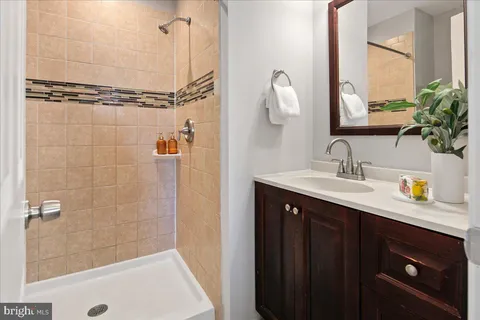 a bedroom with a bed and a sink