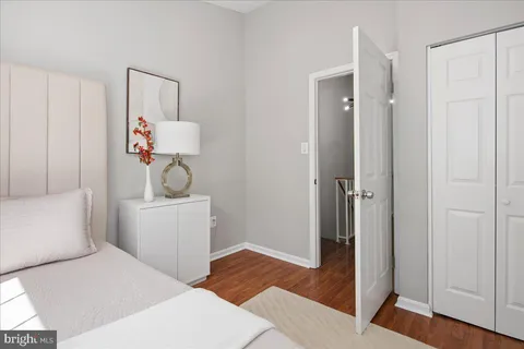a bedroom with a bed and a table