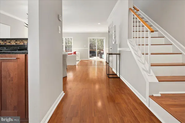 a large white room with a large window and furniture