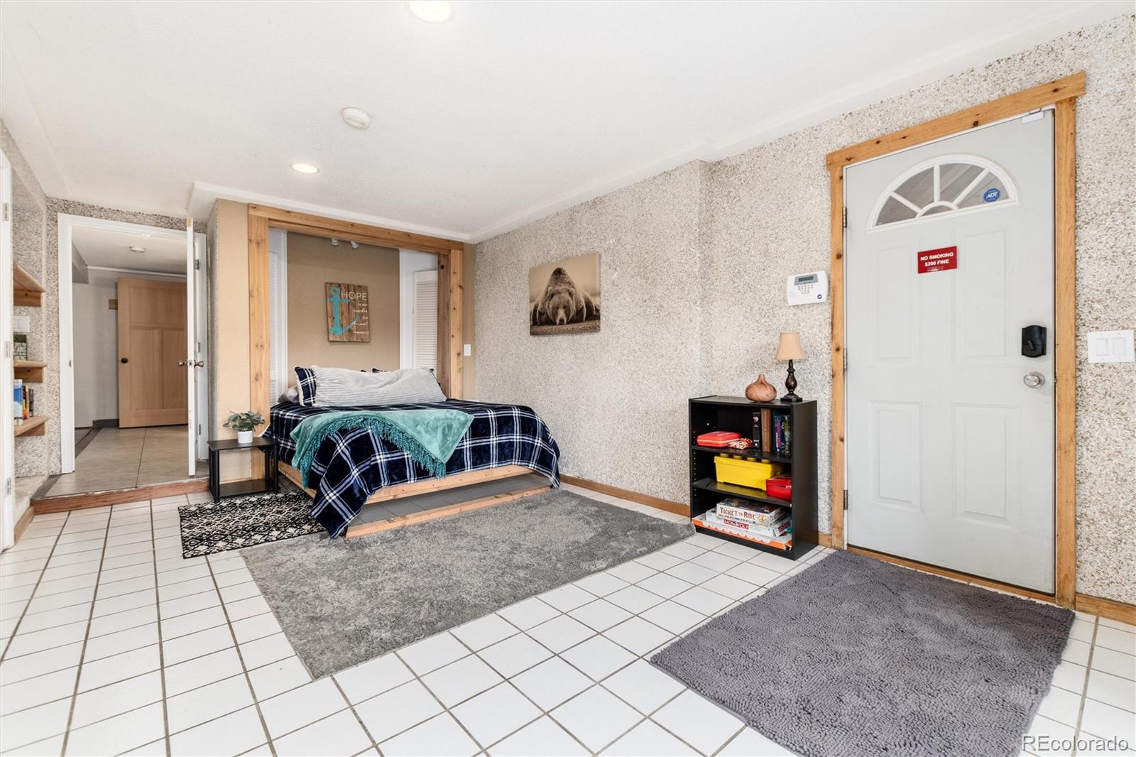 159 Lake Road Idaho Springs, CO 80452 - Photo 21 of 45 a bedroom with furniture and a bed