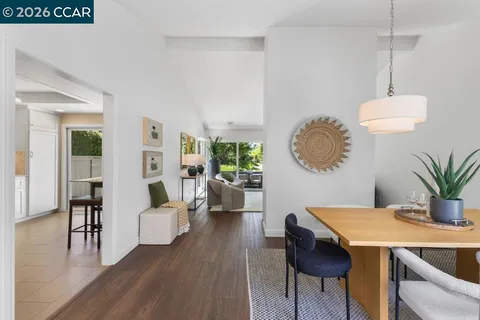 a living room with furniture a window and a table
