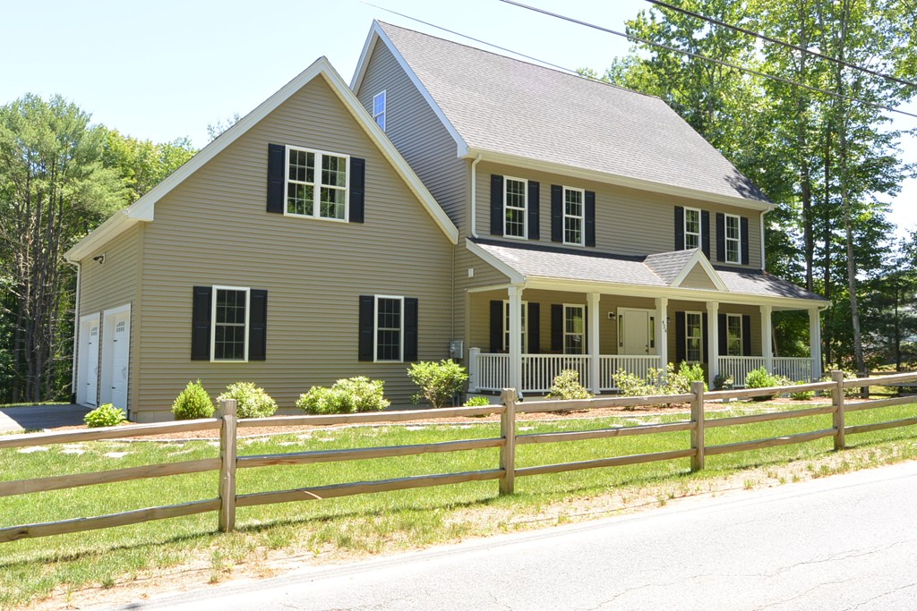 424 Langen Road Lancaster, MA 01523 - Photo 1 of 25 a front view of a house with a yard