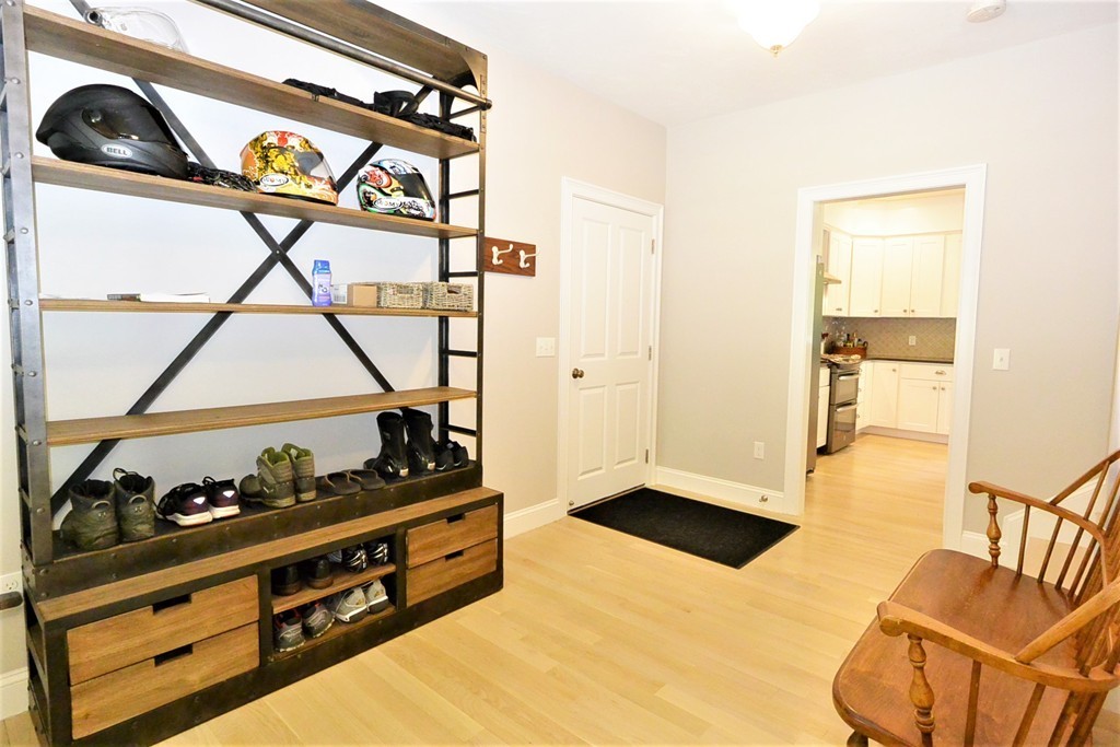 424 Langen Road Lancaster, MA 01523 - Photo 11 of 25 a kitchen with stainless steel appliances granite countertop a stove and a refrigerator