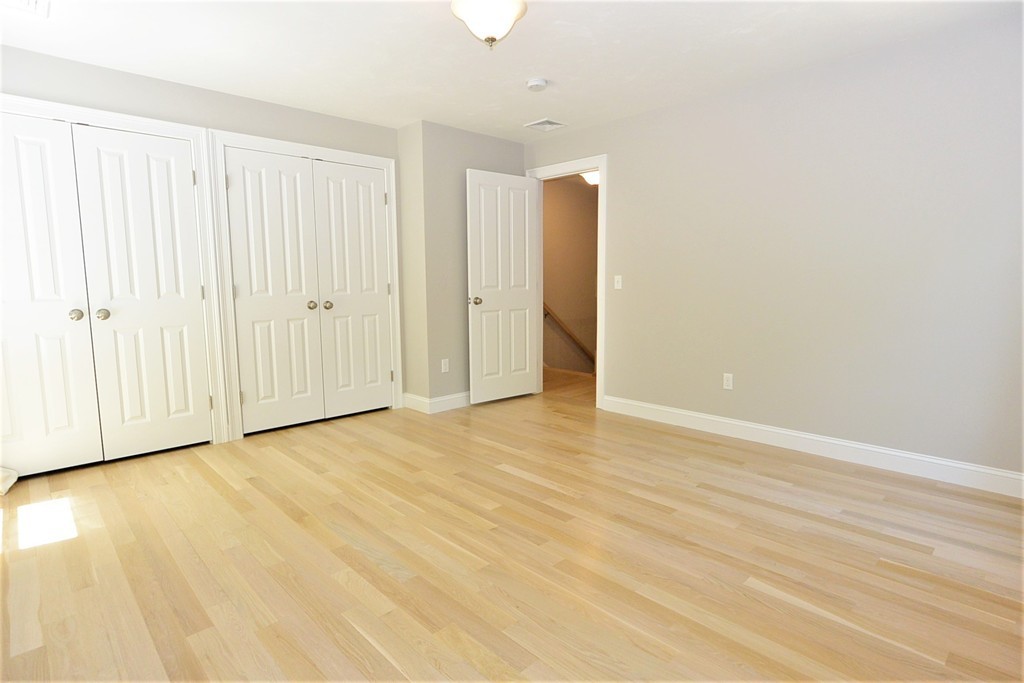 424 Langen Road Lancaster, MA 01523 - Photo 15 of 25 a view of an empty room with wooden floor