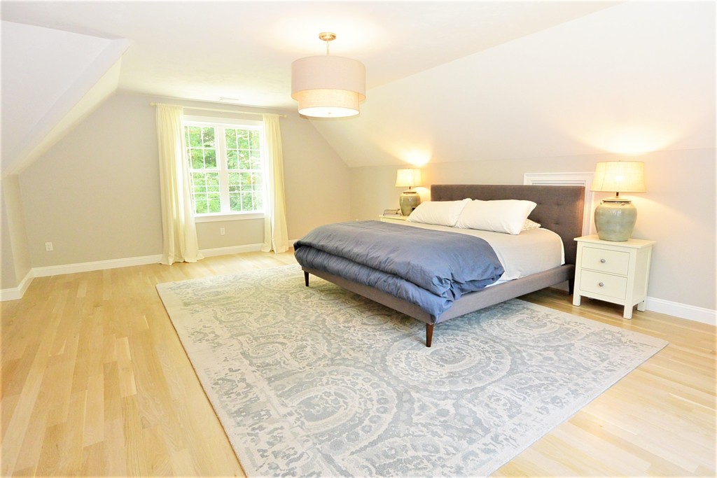 424 Langen Road Lancaster, MA 01523 - Photo 20 of 25 a spacious bedroom with a bed and a window