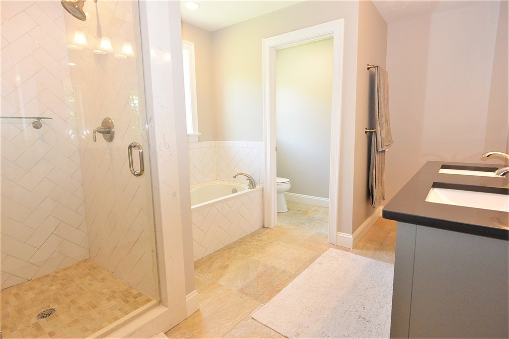 424 Langen Road Lancaster, MA 01523 - Photo 21 of 25 a bathroom with a shower and a toilet