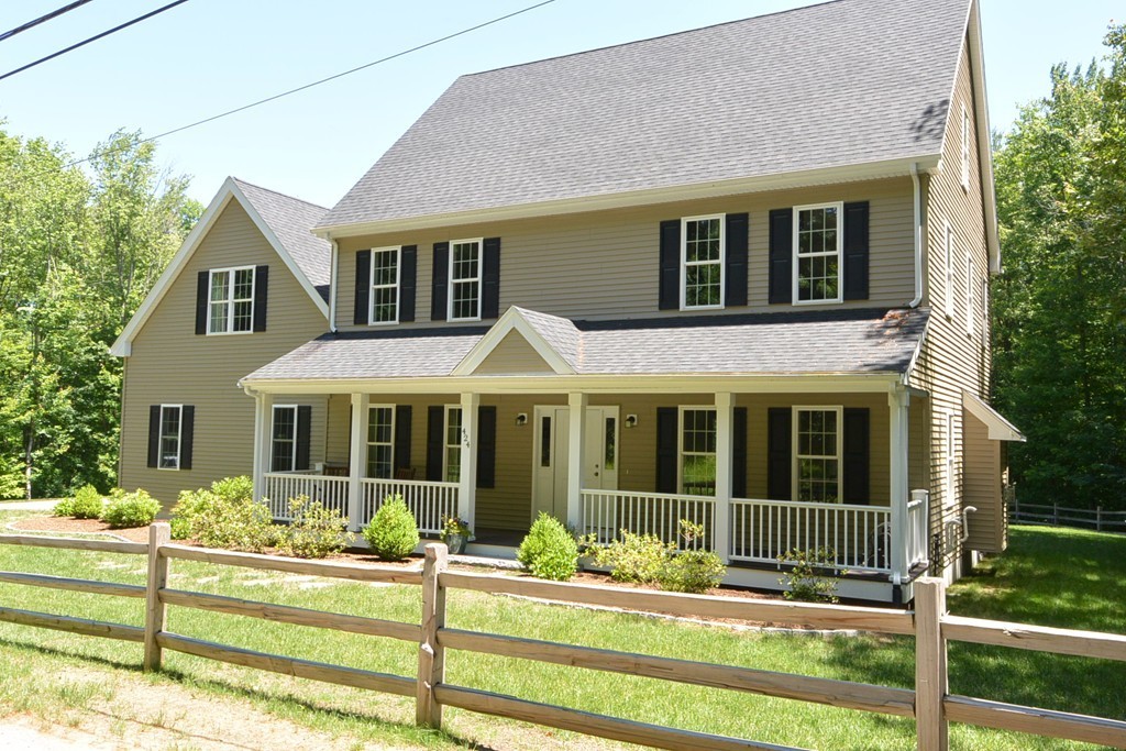 424 Langen Road Lancaster, MA 01523 - Photo 25 of 25 front view of a house with a yard