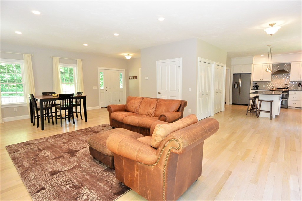424 Langen Road Lancaster, MA 01523 - Photo 6 of 25 a living room with furniture and kitchen view with wooden floor