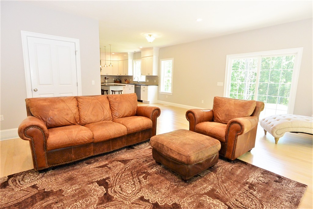 424 Langen Road Lancaster, MA 01523 - Photo 7 of 25 a living room with furniture and a large window