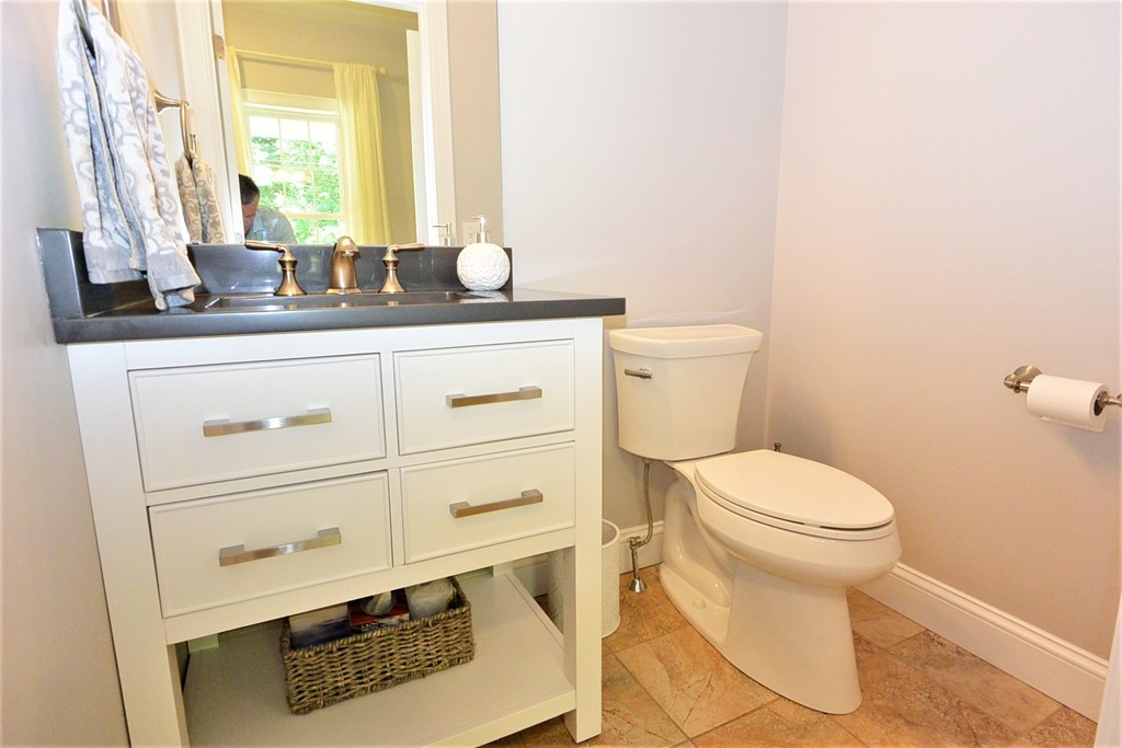 424 Langen Road Lancaster, MA 01523 - Photo 10 of 25 a bathroom with a sink a toilet and a window