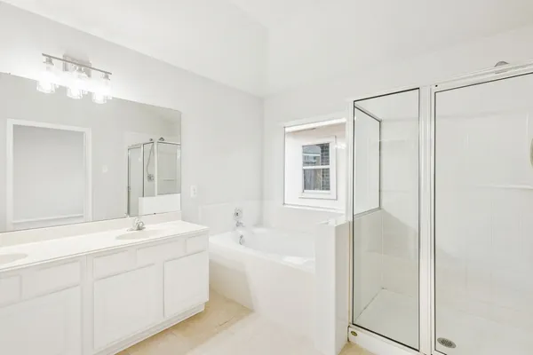 a bathroom with a shower and a tub