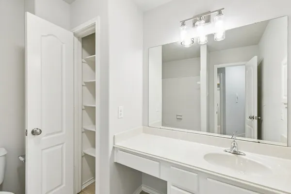 a bathroom with a toilet and a bathtub