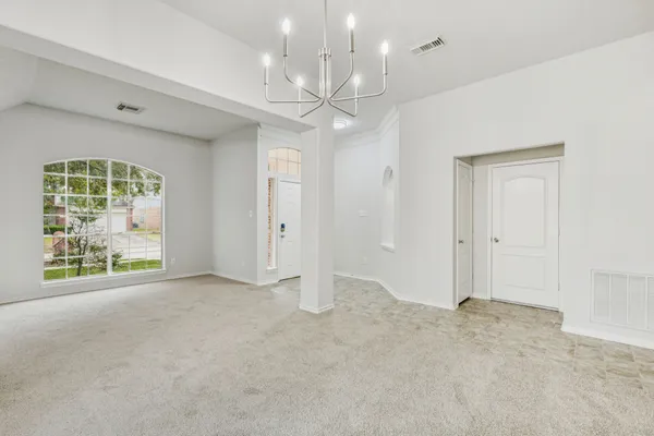 a view of an empty room with a window