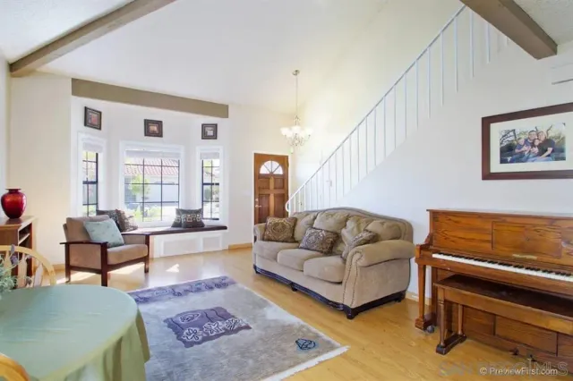 a living room with furniture and a rug