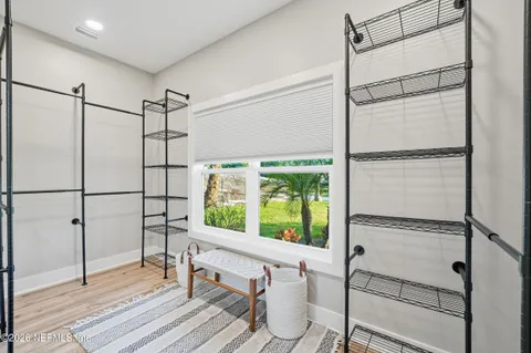 a walk in closet and window