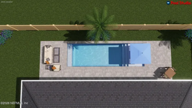 an aerial view of a house with outdoor space and parking
