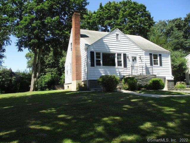 504 Davis Road Fairfield, CT 06825 - Photo 1 of 1 a front view of a house with a yard
