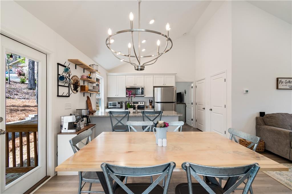 305 Ridgewood Drive Waleska, GA 30183 - Photo 11 of 56 a view of a dining room with furniture and chandelier